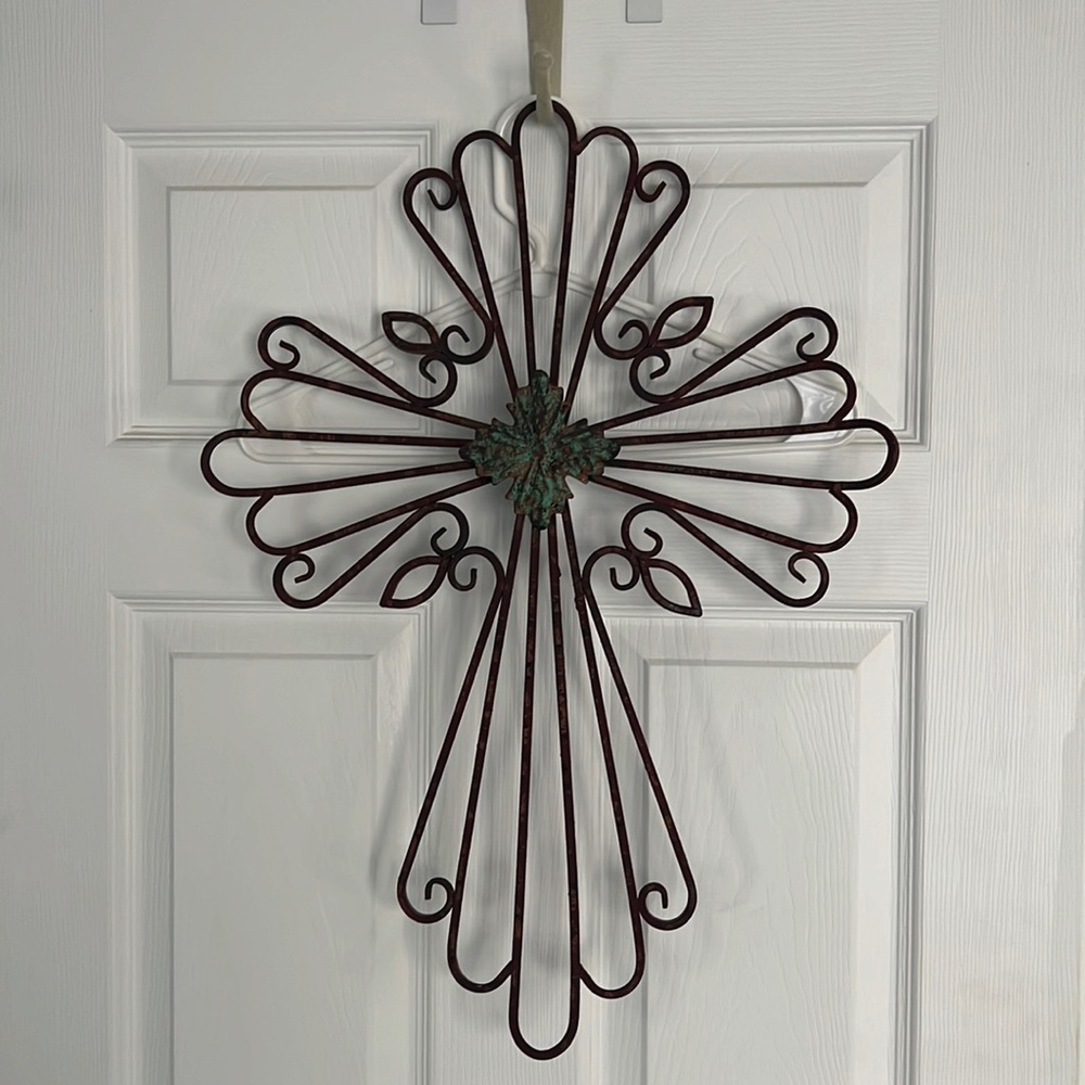 Metal cross home decor with teal & rust center